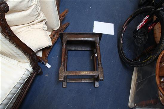 A 17th century oak joynt stool, incised with the initials W. R. 1ft. 7in. H.1ft 9in.